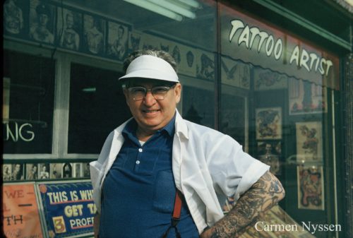 Bert Grimm in front of his Long Beach Pike tattoo shop.