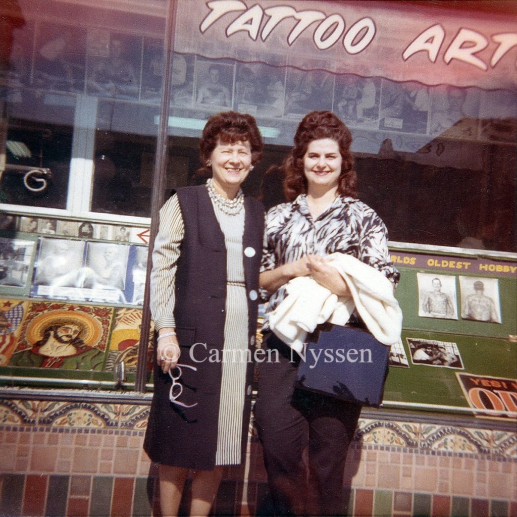 Carmen's grandma with her Aunt Julie Grimm in front of Bert Grimm's Long Beach Pike tattoo shop, c. 1960s.